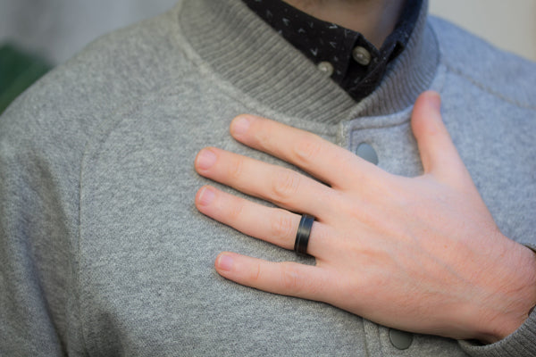 Men's undirectional carbon fiber ring. Unique black wedding band with one stripe. (00131) - Rosler Rings