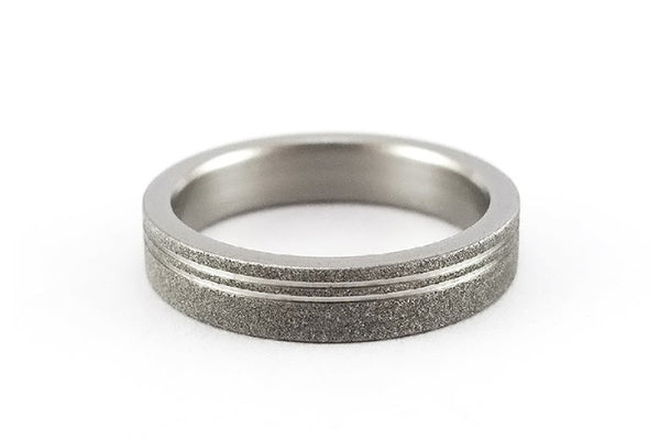 Sandblasted titanium ring with polished inlays (00013_4N)
